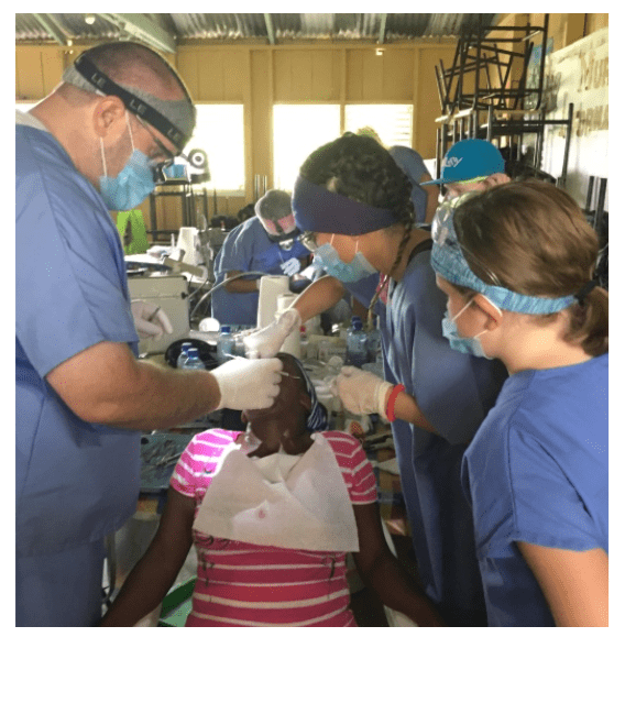 Dr. Auger with a Dominican Republic family during a dental mission